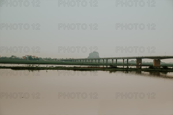 Cinematic dark and moody scenery of a bridge over the river in Ninh Binh, Vietnam, Asia