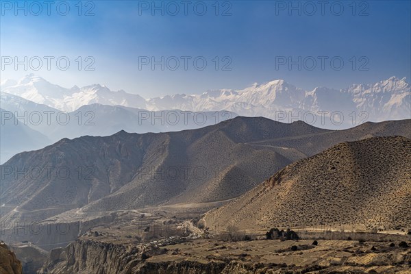 Desert mountain scenery with the Annapurna mountain range in the background, Kingdom of Mustang, Nepal, Asia