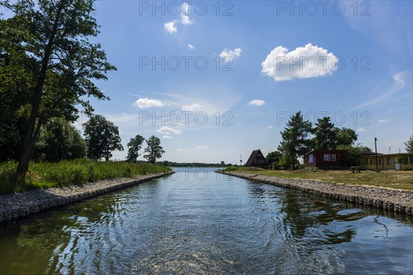 Houseboat ride through the canal in front of the lake, boat, ship, sea voyage, water, fresh water, boat trip, boat excursion, form of travel, journey, holiday, tourism, reed, nautical, Masuria, Poland, Europe