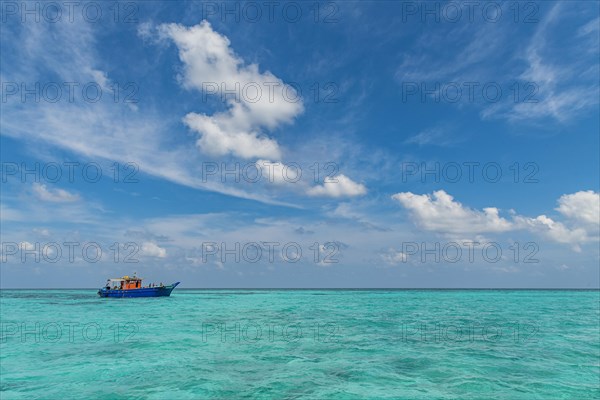 Little boat in the turquoise waters of Agatti Island, Lakshadweep archipelago, Union territory of India