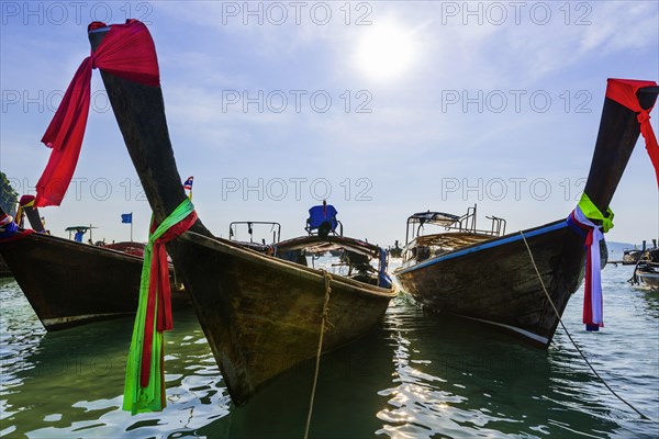 Longtail boat for transporting tourists, water taxi, taxi boat, ferry, ferry boat, fishing boat, wooden boat, boat, decorated, tradition, traditional, bay, sea, ocean, Andaman Sea, tropics, tropical, water, travel, tourism, paradise, beach holiday, sun, sunny, holiday, dream trip, holiday paradise, paradise, nature, idyllic, turquoise, Siam, exotic, travel photo, Krabi, Thailand, Asia