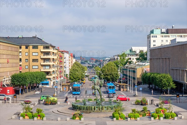 City view of the Avenyn with a water fountain and buses and cars on the city street in Gothenburg, Gothenburg, Sweden, Europe