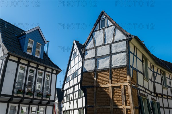 Impressive historic half-timbered house with distinctive structures against a blue sky, Old Town, Hattingen, Ennepe-Ruhr district, Ruhr area, North Rhine-Westphalia