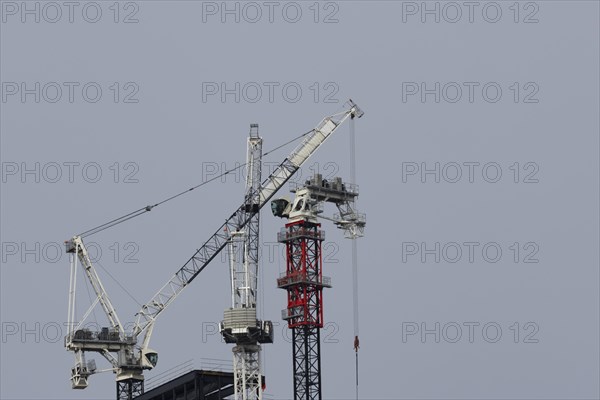 Industrial cranes on a skyscraper, City of London, England, United Kingdom, Europe