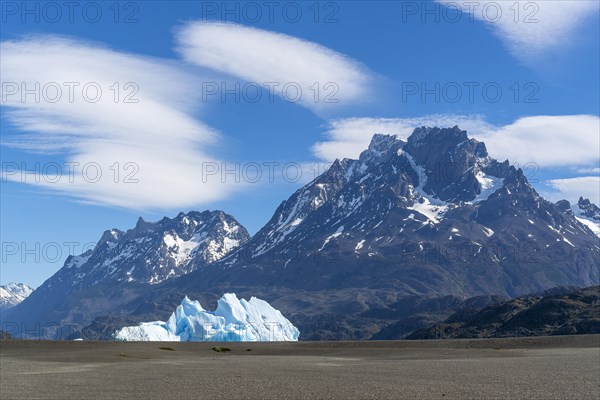 Iceberg and cloud formation, Lago Grey, Torres del Paine National Park, Parque Nacional Torres del Paine, Cordillera del Paine, Towers of the Blue Sky, Region de Magallanes y de la Antartica Chilena, Ultima Esperanza Province, UNESCO Biosphere Reserve, Patagonia, End of the World, Chile, South America