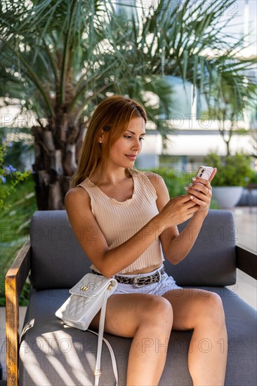 A woman reading something on her smartphone