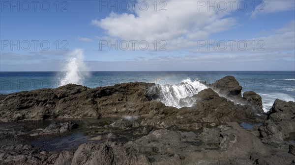 Surf with rainbow, near Los Hervideros, Lanzarote, Canary Islands, Spain, Europe