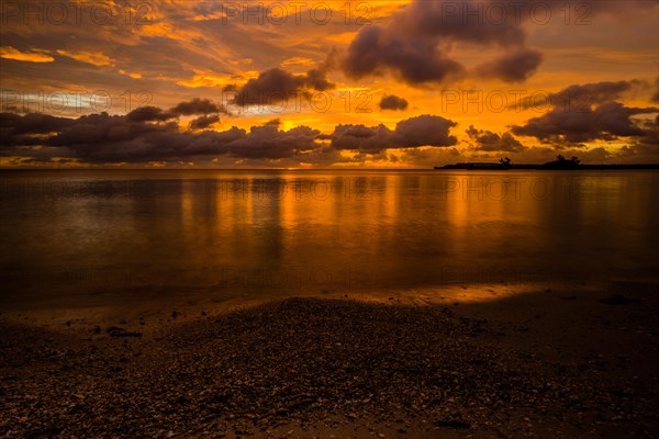 Beautiful sunset over ocean water taken from a beach in Guam