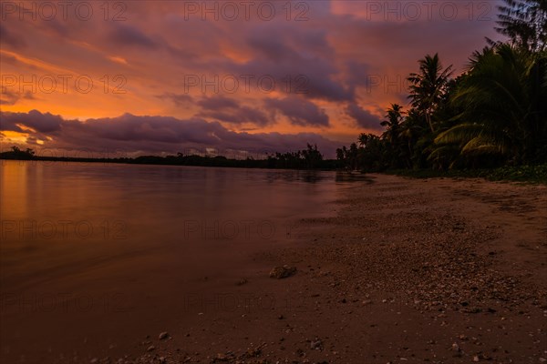 Beautiful sunset over ocean water taken from a beach in Guam