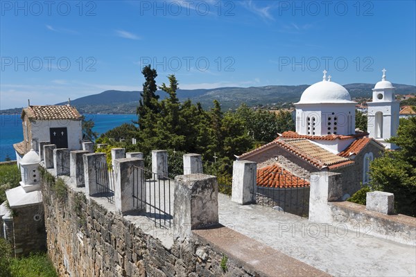 View of churches and the sea, surrounded by a stone wall and red roofs, Byzantine fortress with nunnery, Holy Monastery of Timi Prodromos, Koroni, Pylos-Nestor, Messinia, Peloponnese, Greece, Europe