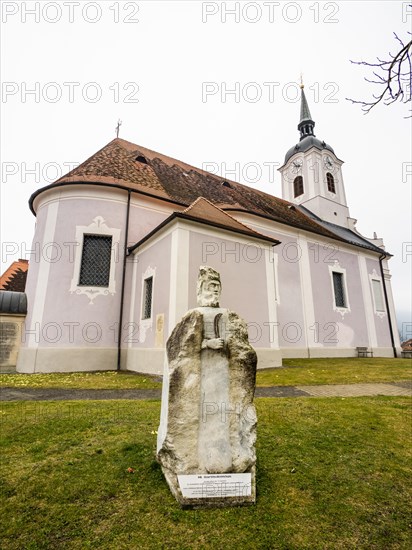 Stone sculpture, St Bartholomew, behind the Roman Catholic parish church of St Nicholas, Stubenberg am See, Eastern Styria, Styria, Austria, Europe