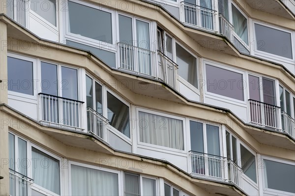 Curved residential building with curved balconies and reflective windows, Blankenberge, Flanders, Belgium, Europe