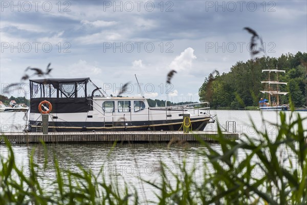 Houseboat on a lake, boat, ship, seafaring, water, freshwater, boat trip, boat excursion, form of travel, journey, holiday, tourism, reed, nautical, Masuria, Poland, Europe