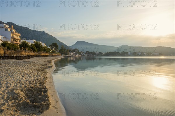 Village by the sea and mountains at sunrise, Port de Pollenca, Serra de Tramuntana, Majorca, Balearic Islands, Spain, Europe