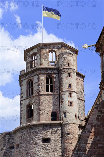 The top of a historic tower with flag and battlements (Heidelberg Castle), under a blue sky, Heidelberg, Baden-Wuerttemberg, Germany, Europe