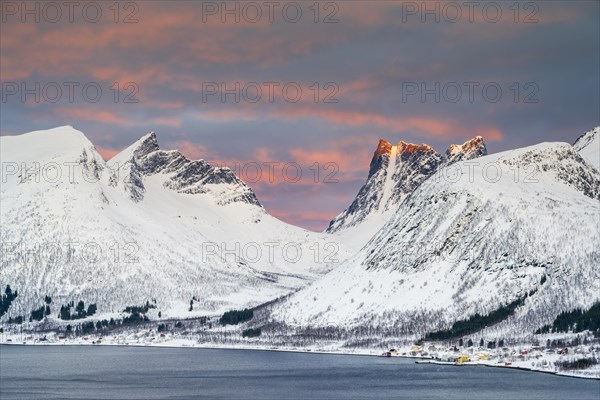 Snow-covered mountains at sunrise, Bergsbotn, Senja Island, Norway, Europe