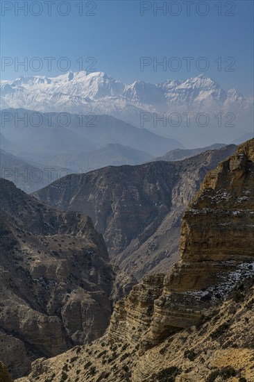 Desert mountain scenery with the Annapurna mountain range in the background, Kingdom of Mustang, Nepal, Asia