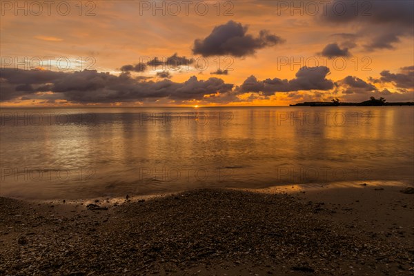 Beautiful sunset over ocean water taken from a beach in Guam