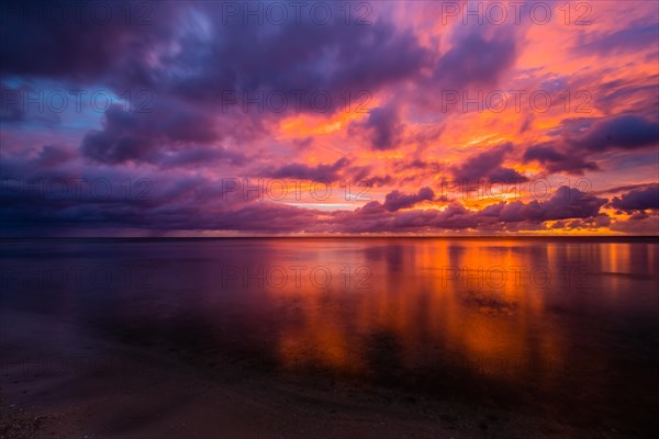 Beautiful sunset over ocean water taken from a beach in Guam