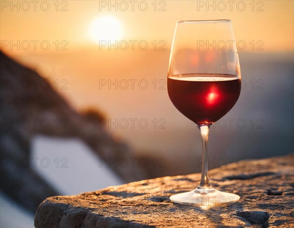 A glass of red wine in the backlight of the sunset, quiet atmosphere, AI generated, AI generated