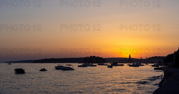 Sunset, boats anchoring in a bay near Rab, panoramic view, town of Rab, island of Rab, Kvarner Gulf Bay, Croatia, Europe