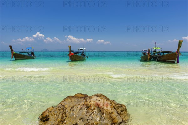 Fishing boat, wooden boat, bathing beach, swimming, bathing, bay, bay, sea, ocean, Andaman Sea, tropical, island, rock, rock, water, beach, beach holiday, Caribbean, environment, clear, clean, peaceful, picturesque, stone, sea level, climate, travel, tourism, natural landscape, paradisiacal, beach holiday, sun, sunny, holiday, dream trip, holiday paradise, paradise, coastal landscape, nature, idyllic, turquoise, Siam, exotic, travel photo, beach landscape, sandy beach, Phi Phi Island, Thailand, Asia