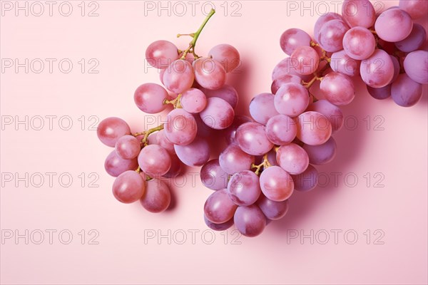 Top view of grape fruits on pastel pink background. KI generiert, generiert AI generated
