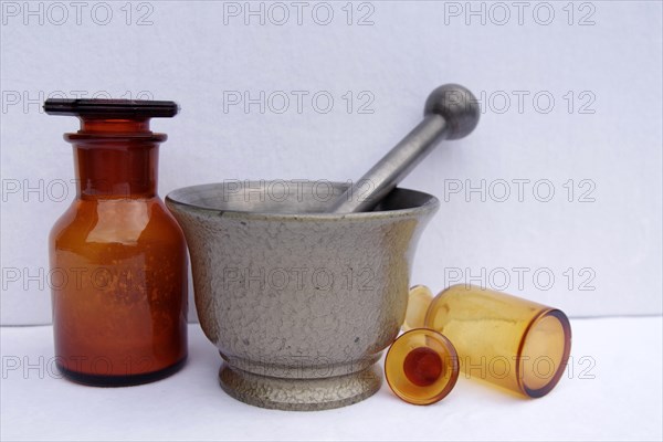 Mortar, pestle, pharmacy, antique, cast iron, glass jar, amber glass, This old pill mortar made of cast iron and the two bottles made of amber glass are antique vessels from the pharmacy