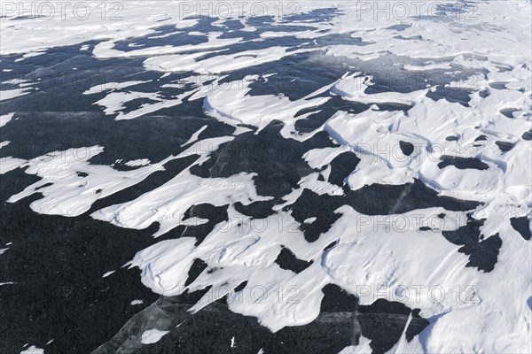 Winter, snow drifts on frozen riverscape, Saint Lawrence River, Province of Quebec, Canada, North America