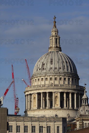 Dome of St Paul's Cathedral with industrial cranes in the background, City of London, England, United Kingdom, Europe