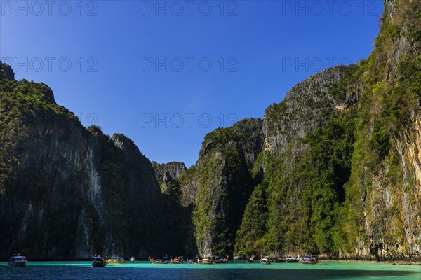 Maya Bay, boat, wooden boat, bay, bay, sea, ocean, Andaman Sea, tropics, tropical, island, rock, rock, water, fishing boat, travel, tourism, limestone, natural landscape, paradisiacal, beach holiday, sun, sunny, holiday, dream trip, holiday paradise, flora, paradise, coastal landscape, nature, idyllic, turquoise, Siam, exotic, travel photo, Ko Phi Phi Don, Thailand, Asia