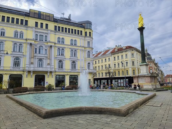 Graz, Austria, 26.03.2023: Mary's Column and fountain in Jakominiplatz Square, famous attraction in the city center of Graz, Steiermark region, Austria, Europe