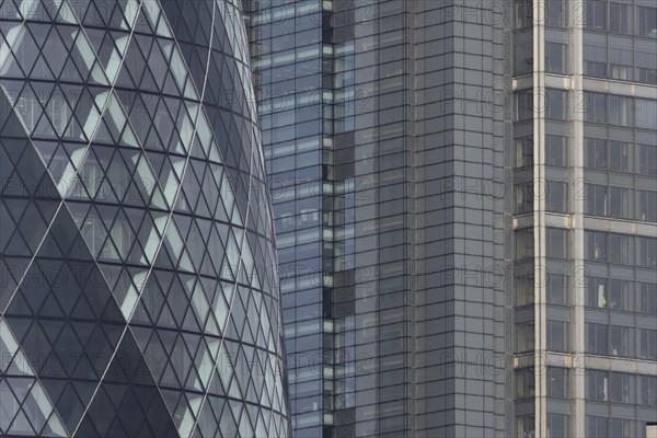 The Gherkin skyscraper building and nearby high rise office building, City of London, England, United Kingdom, Europe