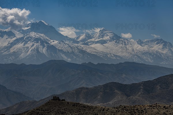 Old fortress in the desert landscape before the Annapurna mountain range, Kingdom of Mustang, Nepal, Asia