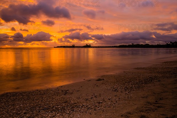 Beautiful sunset over ocean water taken from a beach in Guam