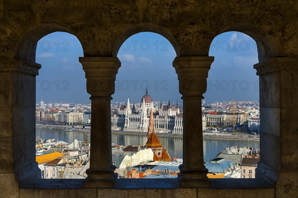 View through the facade of the Fisherman's Bastion to the Danube and the Parliament, politics, city view, travel, city trip, tourism, overview, Eastern Europe, architecture, building, history, historical, cityscape, river, capital, Budapest, Hungary, Europe