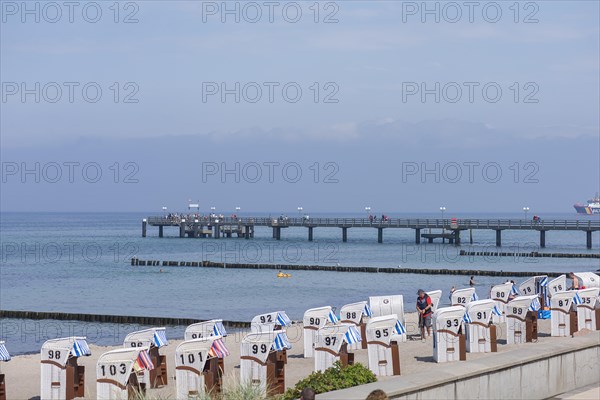 Beach chairs and pier in Kuehlungsborn, Mecklenburg-Vorpommern, Germany, Europe