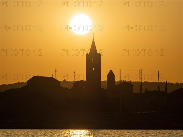 Golden evening light at sunset, silhouette of the church towers of Rab, town of Rab, island of Rab, Kvarner Gulf Bay, Croatia, Europe