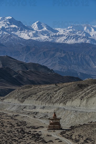 Stupa in a desert landscape before the Annapurna mountain range, Kingdom of Mustang, Nepal, Asia