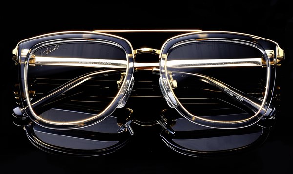Stylish eyeglasses with clear lenses and gold trim offering a luxury feel AI generated