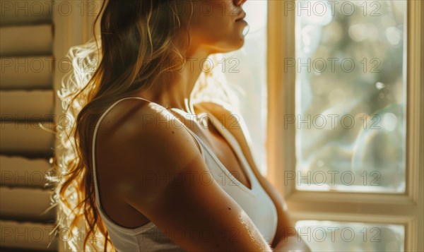 A woman in contemplative mood by a sunny window AI generated