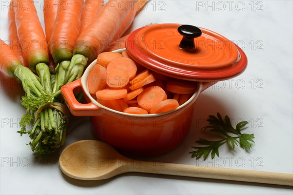 Sliced carrots in pot and bunch Carrots, Daucus carota, carrots