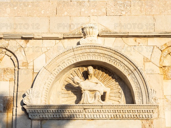 Stone sculpture, Mary holding the dead Jesus, detail on the former Cathedral of the Assumption of the Virgin Mary, west facade, Rab, Rab Island, Kvarner Gulf Bay, Croatia, Europe