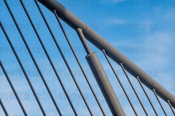 Detail of a curved bridge railing in front of a clear blue sky, Oberhausen, North Rhine-Westphalia, Germany, Europe