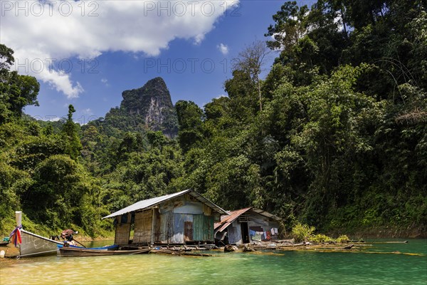 Inhabited huts in Cheow Lan Lake in Khao Sok National Park, locals, live, nature, travel, holiday, lake, reservoir, landscape, rock, rock formation, attraction, rock face, water, tourism, boat trip, excursion, boat trip, nature reserve, travel photo, Thailand, Asia