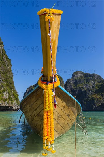 Longtail boat at Maya Bay, boat, wooden boat, ferry boat, ferry, passenger ferry, decorated, faith, tradition, Thai, Asian, traditional, sea, ocean, Andaman Sea, tropics, tropical, island, rock, rock, water, fisherman, fishing boat, travel, tourism, beach holiday, beach holiday, holiday, dream trip, holiday paradise, flora, paradise, coastal landscape, nature, idyllic, boat, turquoise, Siam, exotic, Ko Phi Phi Don, Thailand, Asia