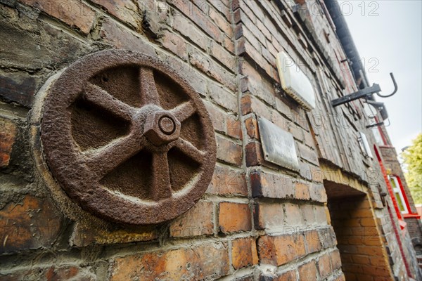 Metal rusted ankra protects house from damage on wobbly post-mining land, Katowice, Nikiszowiec, Silesia, Poland, Europe