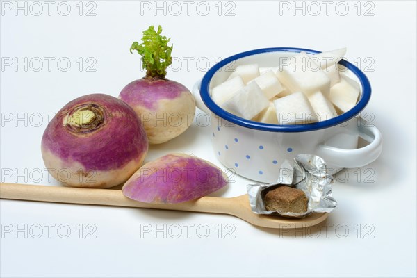 Purple beetroot and sliced beetroot in pot, cooking spoon with stock cube, Brassica rapa