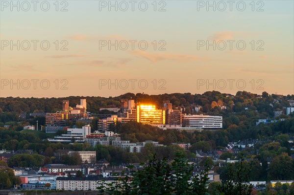 Sunlight reflected in the windows of a building at sunset in an urban landscape, Bergische Universitaet, Elberfeld, Wuppertal