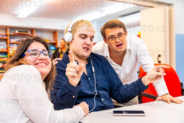 Disabled people having fun listening to music together in a leisure room